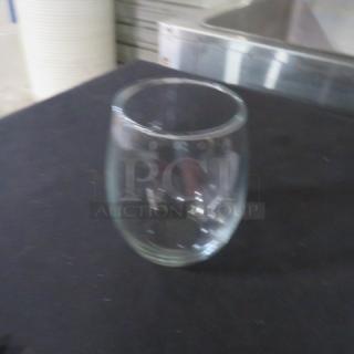 Luminarc 20.75oz stemless wine glass on black surface, clear and in good condition.