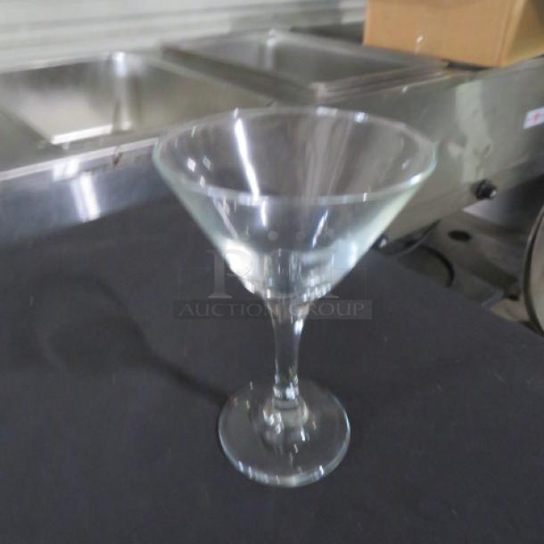Embassy 9-1/4oz martini glass, clear glass, elegant design, excellent condition, shown on a black surface.