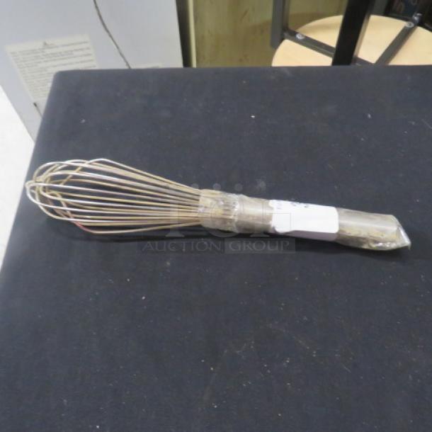 Stainless steel whip, wrapped in plastic. New condition, with visible packaging label indicating item information.