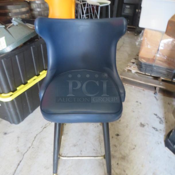 Vintage bar stool with tufted back, footrest, and black upholstery. Features sturdy metal legs. Good condition.