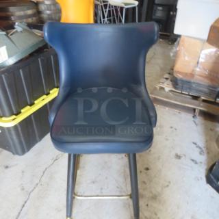 Vintage bar stool with tufted back, footrest, and black upholstery. Features sturdy metal legs. Good condition.
