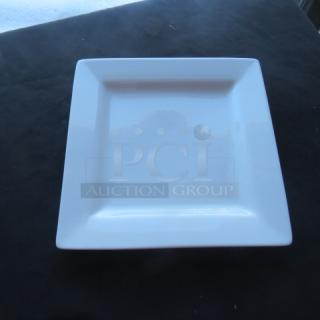 World 10.5" white square plate, model SL10. Excellent condition, sleek design. Retail price: $188.99.