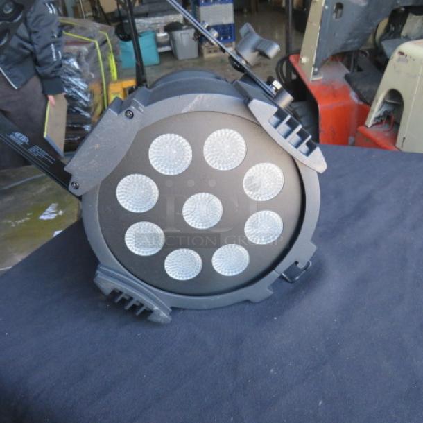 Phillips SHOWLINE SLPAR150 ZOOM can light, 100-240 volt, features nine LED lenses. In good condition. Model and branding visible.