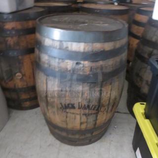 Jack Daniels wooden whiskey barrel, vintage look, branded logo, used condition with metal bands, some wear visible.