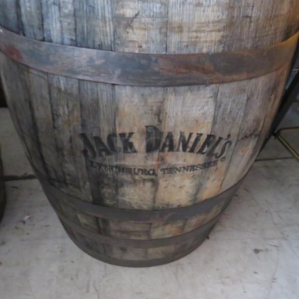 Vintage Jack Daniels wooden whiskey barrel with logo, rustic finish, slight wear; from Lynchburg, Tennessee distillery.