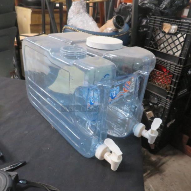 Clear plastic freshwater tank with dual spigots, various sizes. Includes visible H2O labels. Used condition.