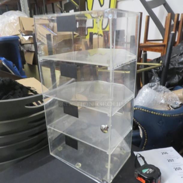 Acrylic pastry case with 1 door, 4 shelves, 13x12x24.5 inches. Needs pin for top hinge. Transparent with visible knob.