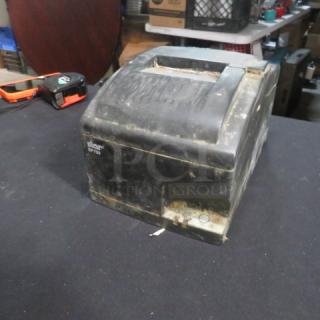 Star SP700 thermal printer, worn condition with visible marks and scratches. Model label: "Star SP700."
