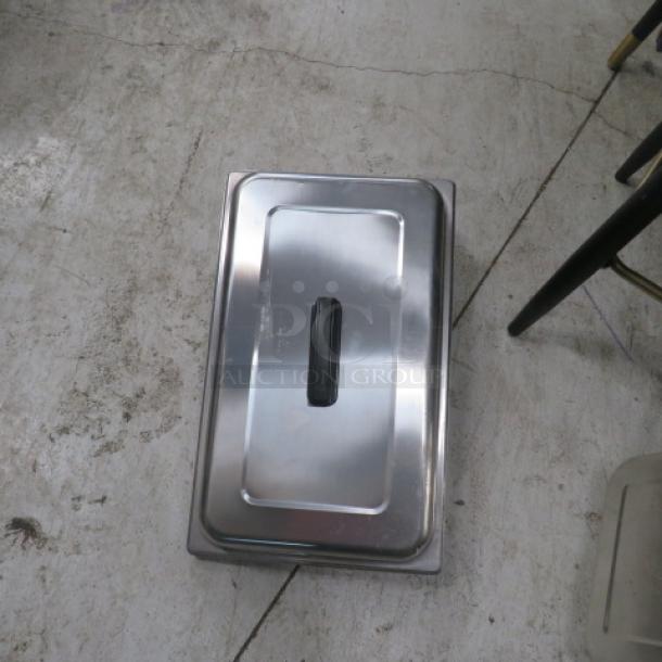 Stainless steel full-size chafer lid, model 4XBID, with black handle; appears in good condition.