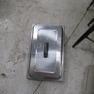Stainless steel full-size chafer lid, model 4XBID, with black handle; appears in good condition.