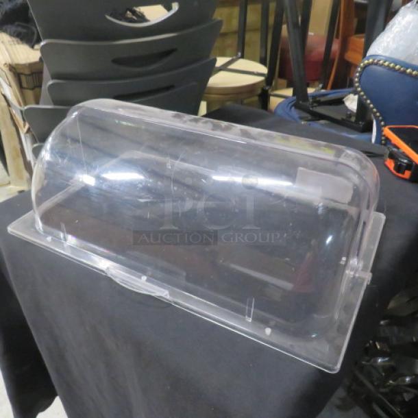 Clear acrylic roll top lid, full size, with minor scratches, used condition. Ideal for buffet setups, durable and practical.
