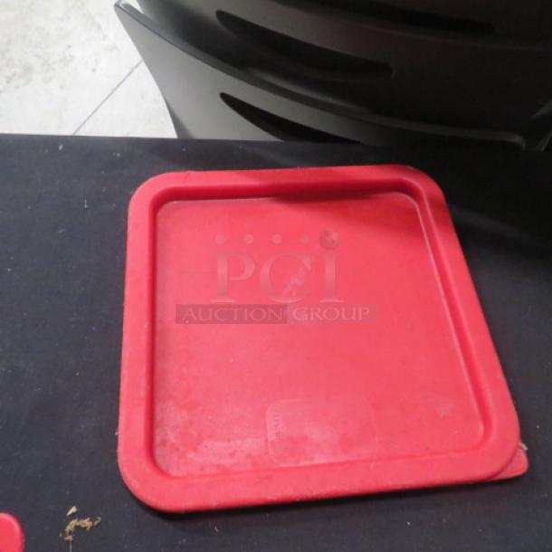 Red Carlisle 6/8 Qt Lid, model 6XBID, in used condition. Square shape with raised edges. No visible markings.