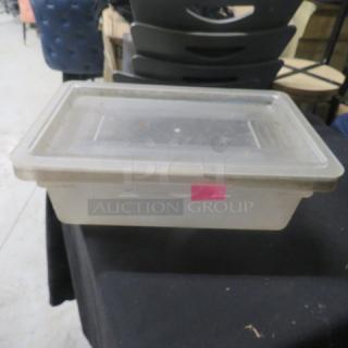 3.5-gallon food storage container with lid, clear plastic, used condition. Rectangular shape, pink label visible on the side.