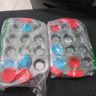 New mini muffin pan with silicone inserts, packaged. Includes red and blue removable cups. Mint condition.