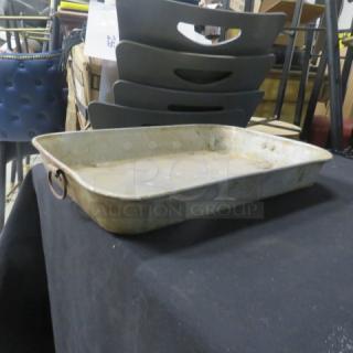 One aluminum roasting pan, 18x12x3 inches, with handles. Used condition, visible wear and patina.