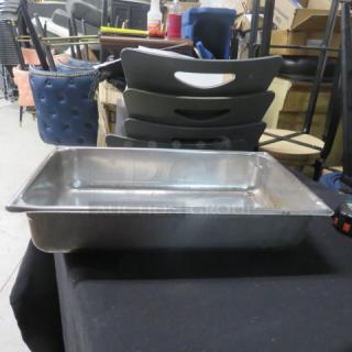 Full size 4-inch deep stainless steel hotel pan, used condition, minor scratches, no visible brand markings.