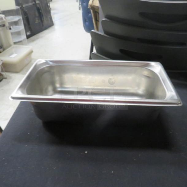 1/3 size, 4-inch deep stainless steel hotel pan. Used condition. Model 3XBID. No visible tags or labels.