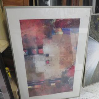 Framed abstract picture, 27x39 inches, featuring vibrant colors and geometric shapes, in good condition.