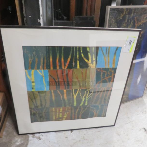Framed abstract picture, 32.5x32.5 inches, depicting colorful tree trunks. Good condition, with lot number tag visible.