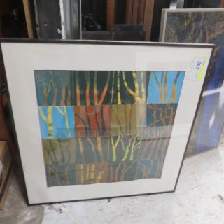 Framed abstract picture, 32.5x32.5 inches, depicting colorful tree trunks. Good condition, with lot number tag visible.