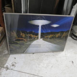 Framed 36x24 picture depicting a UFO-themed landscape, in good condition, with vibrant colors and a sleek frame.