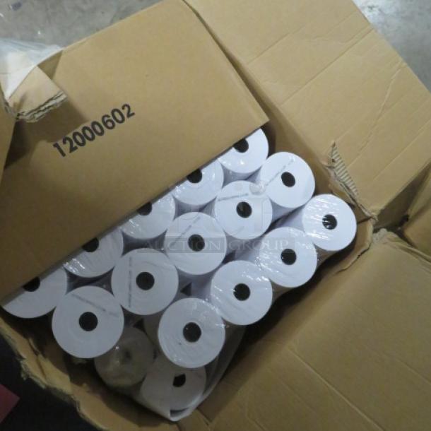 Case of white roll tape, unopened in a slightly damaged cardboard box labeled "12000602". Rolls tightly packed.