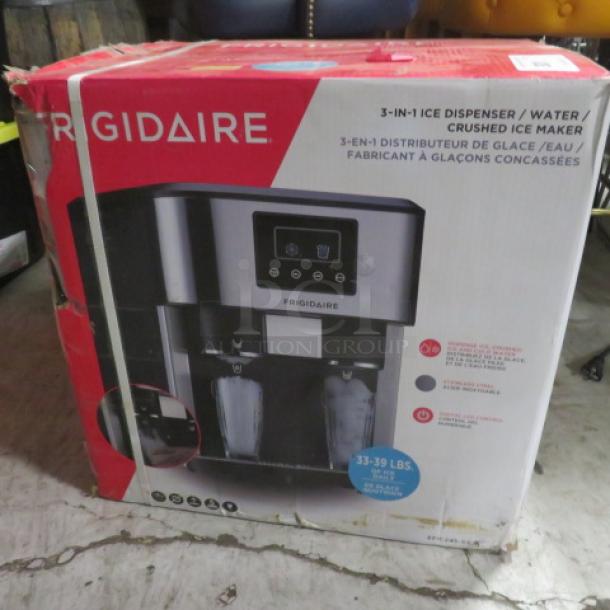 Frigidaire EFIC245-SS ice, water, and crushed ice maker/dispenser box, 33-39 lbs/day capacity, red packaging.