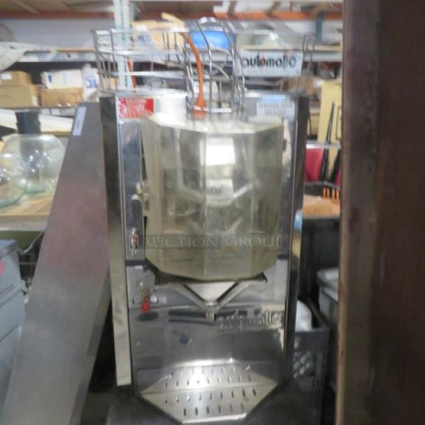 Automatic feed citrus juicer with self-serve tap, Model JM-30. Stainless steel, 18x24x31 inches, used condition.