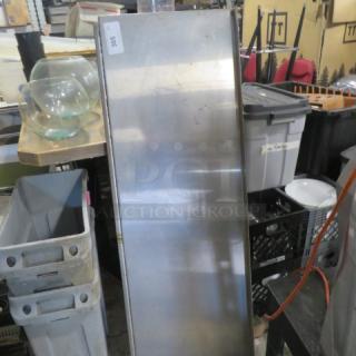 Stainless steel shelf with brackets and ticket rail, 60x18x10.5 inches, showing some wear. Marked with a label "305".