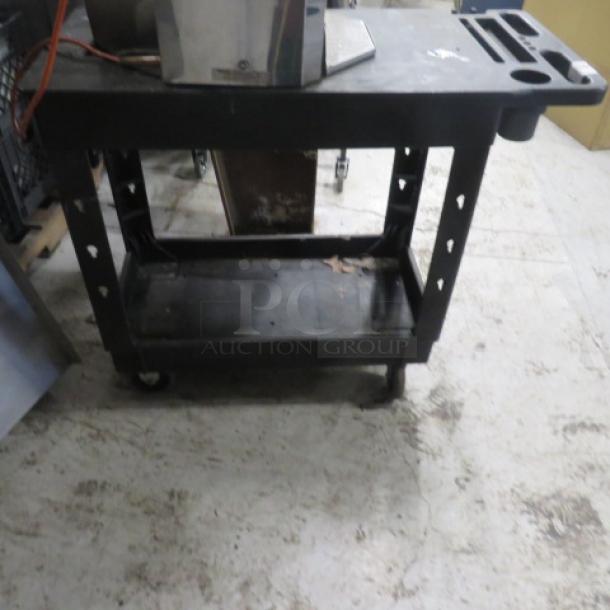 Global black poly 2-shelf cart on casters, featuring a cutout on the top shelf. Measures 17.5x38.5x32.5 inches.