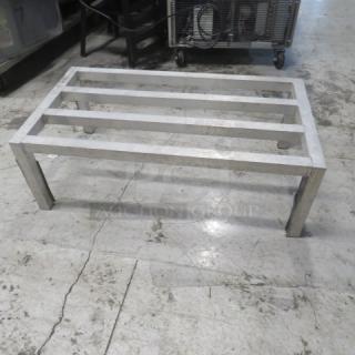 Aluminum dunnage rack, 36x20x12 inches, sturdy frame, used condition, ideal for storage and organization.