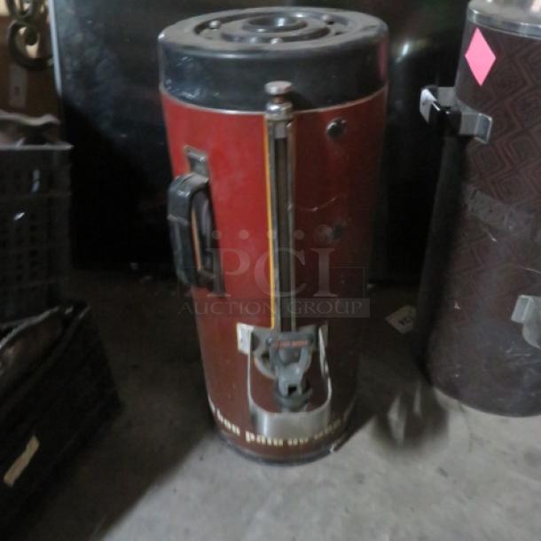 Fetco Luxus 1.5 Gallon Beverage Dispenser, model TDP-15, red, with visible wear and handle, auction item.