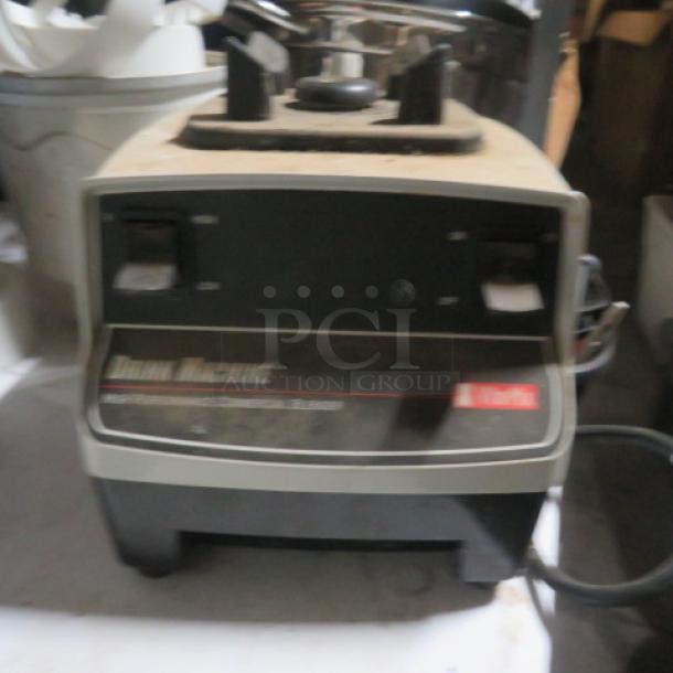 Vitamix VM0100 Mixer, 120 Volt, in used condition. Features power controls and branding on the base.
