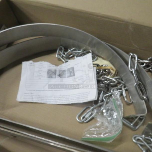 Stainless steel pot/pan holder with chains; includes instruction sheet, packaged in a cardboard box.