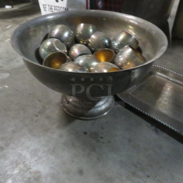 Assorted silver-plated serveware set, includes large bowl with pedestal and multiple cups, tarnished condition.