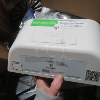 Dualite Commercial LED Emergency Light #EVHC61DP-0-WM, new, battery compartment, warranty info visible, white unit.