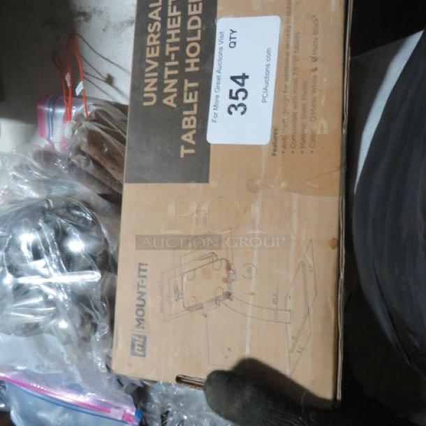 Universal Anti-Theft Tablet Holder, new in box, Mount-It! brand, model MI-3778, secure design, includes installation kit.