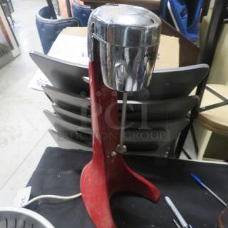 Waring Pro Mixer with stainless steel cup, model #12DM19, in used condition. 120 Volt, red base with chrome top.