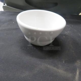White ceramic salsa bowl, slightly used, with a clean, glossy finish. No visible markings or brand labels.