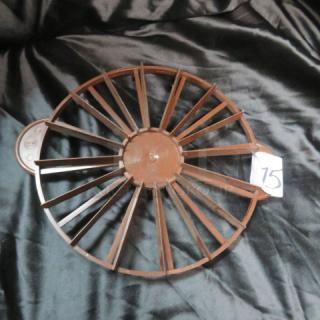 Brown plastic pie cutter with multiple blades, circular design, label marked "75." Appears in good condition.