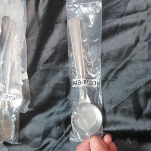 NEW stainless steel scoop in packaging, model MB-81003, pristine condition, suitable for kitchen or commercial use.