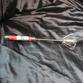Red-and-silver handheld whip, metal mixing ends, good condition, marked with a label displaying "32".