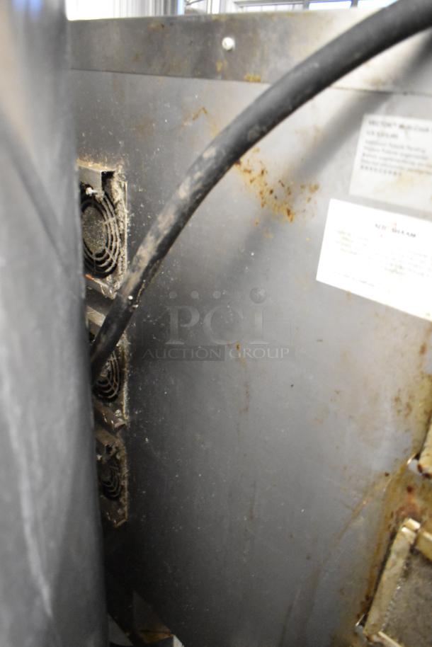 2020 Alto Shaam VMC-F4E stainless steel commercial oven back view, showing vents and power cable. Visible stains and wear.