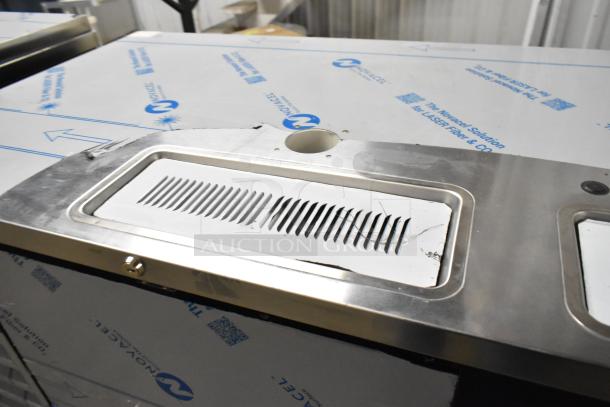 Beverage Air DD68HC-1-B-016 kegerator, dual tap, 115V, metal, new scratch and dent with protective wrap and vent details.