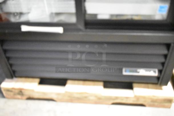 Brand new True GDM-33-HC-LD 2-door cooler, metal, minor scratches, poly-coated racks, 115V, 1 phase, on pallet.