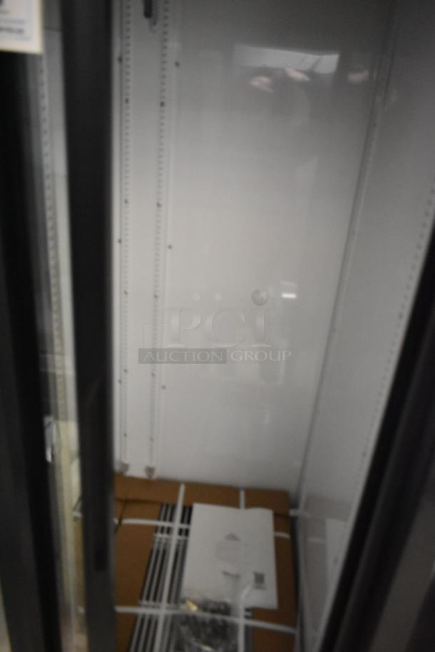 True GDM-33-HC-LD cooler, brand new scratch and dent, 2-door reach-in, poly-coated racks included, 115V, 1 phase.