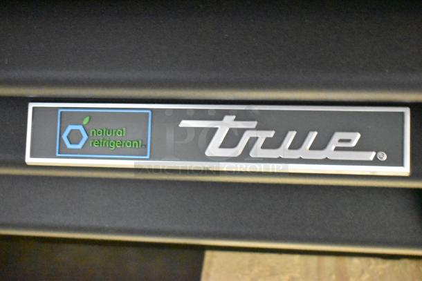 Alt text: "True GDM-33-HC-LD Cooler Merchandiser label with 'natural refrigerant' marking, brand new condition."