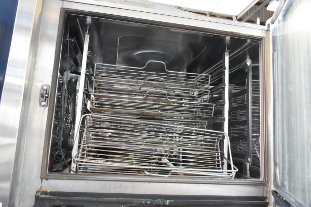 Rational iCombiPro convection oven interior, showing stainless steel racks. Model LM100CE.AXXXX/LM100EE.AXXXX, electric, 440/480V, 3-phase.