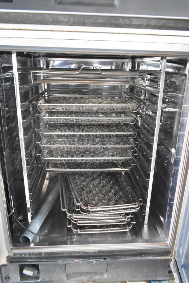 Rational iCombiPro convection oven interior with trays. Stainless steel, electric, 440/480V, 3-phase. Model LM100CE.AXXXX.