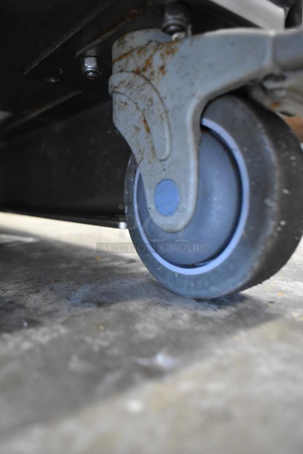 JBT 2ND-GEN-MFJ-HE Citrus Juicer on caster. Stainless steel, commercial floor model, runs on 120 volts, phase 1.